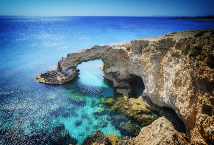 Beautiful natural rock arch near of Ayia Napa, Cavo Greco and Protaras on Cyprus island, Mediterranean Sea. Legendary bridge lovers.