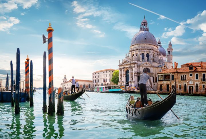 Ride on gondolas along the Gand Canal in Venice, Italy